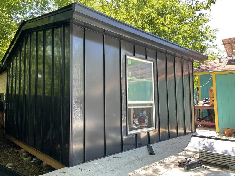 Black standing seam metal wall panels for Roof Inspection in Hopedale